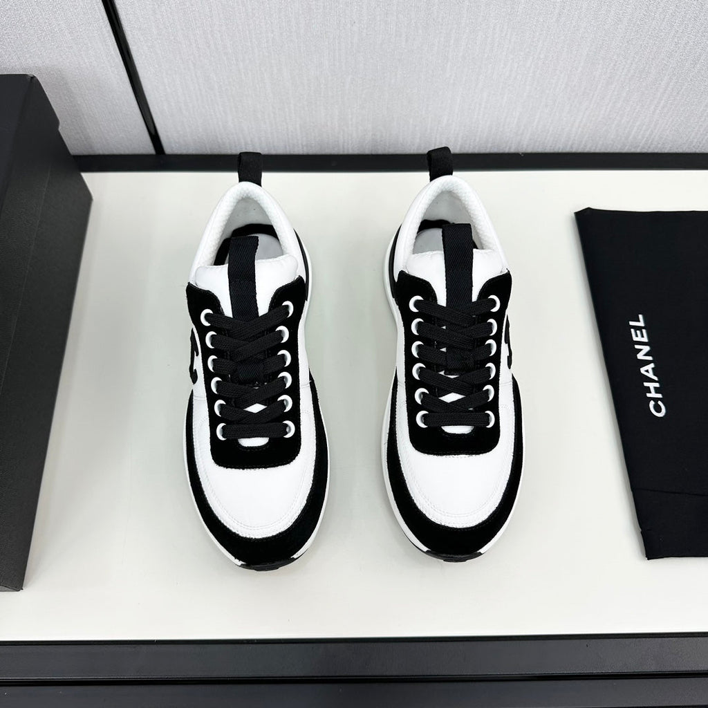 CHANEL SNEAKER IN BLACK SUEDE AND WHITE CALFSKIN